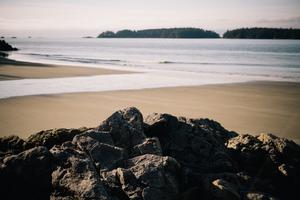 Sandy beach with rocks in the foreground